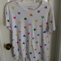 Cute Mickey Multi Color Mickey’s Never Worn Multicolor Disney T-shirt For Summer, White Disney Tops For Summer, Summer Disney T-shirt Relaxed Fit, Disney Cotton Tops For Spring, Disney Cotton T-shirt For Spring, Graphic Print Tops For Disney Fan Events In Summer, Casual T-shirt For Disney Fan Events In Summer, Spring Disney Style Short Sleeve Tops, White Disney T-shirt For Spring