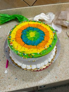 a colorful cake sitting on top of a counter