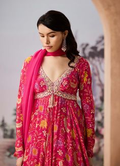 Step into refined elegance with this chintz-printed anarkali, beautifully adorned with dabka and French knot hand embroidery on the neckline. The ensemble is paired with a delicate silk organza dupatta, adding a touch of grace and sophistication, making it perfect for festive occasions or celebrations. Floral Chintz, Printed Anarkali, French Knot, Organza Dupatta, Embroidered Neckline, Silk Organza, Fuchsia Pink, Modern Bride, Indian Design