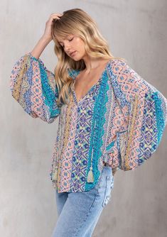 [Color: Turquoise Multi] A model wearing a beautiful turquoise paisley bohemian hippie peasant blouse with billowy volume sleeves. Bohemian Top, Voluminous Sleeves, Resort Fashion, Bohemian Blouses, Bohemian Tops, Flowy Top, Flowy Tops, Peasant Blouse, Hippie Bohemian