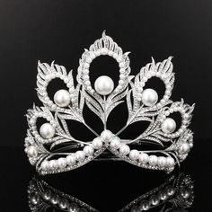 a tiara with pearls and leaves on it