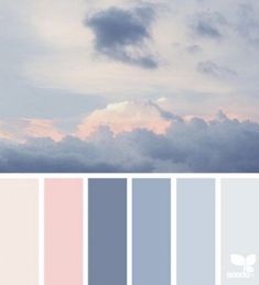 the sky is filled with clouds and pastel colors that are pale, blue, pink, and grey