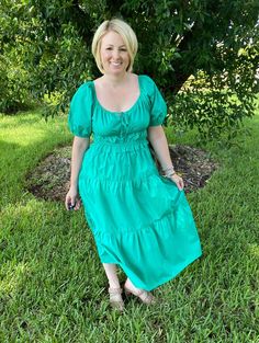 This green puff sleeve tiered midi dress is absolutely stunning for every season. With its scoop neck tie front, pockets, and elastic waist, this dress is super comfy while being incredibly classic. Wear it to work, church, brunch, running errands, date night - I mean, the possibilities are endless. Pair with wedges, fun jewelry, and make it your own! We love a blank slate dress like this! Brand: Skies are BlueDescription: Green dress with tie scoop neck; pockets; tieredFit Info: Runs a little o Green Puff Sleeve Midi Dress For Brunch, Casual Green Midi Dress With Puff Sleeves, Green Tiered Midi Dress For Spring, Green Tiered Midi Dress For Brunch, Green Tiered Skirt Midi Dress For Spring, Green Tiered Ruched Midi Dress, Green Tiered Skirt Midi Dress For Brunch, Green Ruched Tiered Midi Dress, Modest Green Midi Dress For Brunch