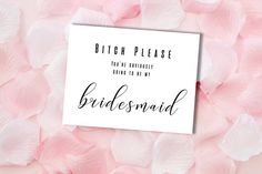 the bridesmaid card is surrounded by pink flowers and petals on a light pink background