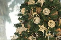 a decorated christmas tree with gold and white ornaments