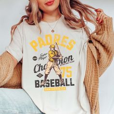 Padres Vintage Baseball Team Graphic Tee - Limeberry Designs Collegiate Baseball Jersey With Graphic Print For Fans, Fan Apparel Baseball Jersey With Graphic Print, Baseball Season Fan Merchandise Graphic Print Tops, Baseball Jersey With Graphic Print For Game Day, Graphic Print Tops For Baseball Season Fan Merchandise, Throwback Baseball Fan Tops, Throwback Tops For Baseball Game Day, Collegiate Cotton Baseball Jersey With Graphic Print, Retro T-shirt With Screen Print For Baseball Season