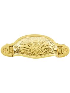 an ornate gold door handle on a white background