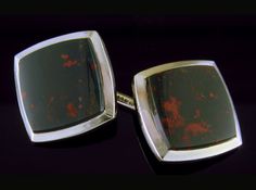 "Striking heliotropes set in bright, white gold bezels.  These cufflinks are in the elegant Art Moderne style of the late Art Deco period.  Created by Carter, Gough & Co. in 14kt gold circa 1930. Heliotrope, more commonly known as \"bloodstone,\" is a dark green variety of quartz with smoldering red spots that glow like fiery embers resting in a bed of dark ashes.  These elegant cufflinks are set with beautiful specimens of the alluring gemstone. The yellow gold backs of the cufflinks are as fin Art Deco Clip-on Jewelry For Formal Occasions, Modernist Oval Jewelry For Formal Occasions, Formal Art Deco Clip-on Jewelry, Modernist Rectangular Jewelry For Formal Occasions, Clip-on Art Deco Jewelry For Formal Occasions, Antique Cufflinks With Polished Finish, Antique Cufflinks With Polished Finish For Business, Antique Business Cufflinks With Polished Finish, Antique Hallmarked Cufflinks For Formal Occasion