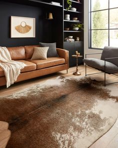 a living room filled with furniture and a brown rug