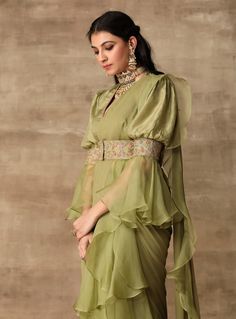 This set features an apple green embroidered silk blouse with an attached belt paired with chiffon-organza draped ruffle saree. Fabric: Silk; Chiffon; Organza Color: Apple Green; Deep Coral Care: D... Belt Saree, Ridhi Mehra, Ruffle Saree, Chic Tops, Sleeves Designs For Dresses, Designer Party Wear Dresses, Trendy Sarees, Trendy Blouse Designs, Stylish Party Dresses