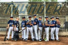 a group of young baseball players standing next to each other