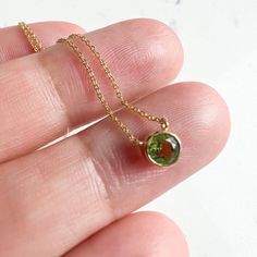 The summer tones of peridot are wrapped in this gold bezel birthstone pendant necklace14K Yellow GoldPeridot 0.36ctLobster clasp Summer Tones, Solitaire Necklace, Solitaire Necklaces, Birthstone Pendant, Birthstone, Yellow Gold, Yellow, Pendant, Gold