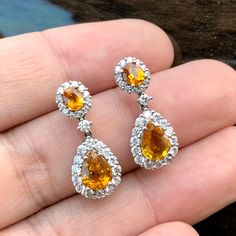 ENJOY OUR WORRY-FREE SERVICE AND THE DAZZLING, GENUINE JEWELRY WE DESIGN AND HANDCRAFT WITH LOVE❤️ ABOUT THE ITEM: CERTIFIED 4.22 Total Carats, Thai yellow sapphires and 1.02 carats of E/VVS, natural diamonds, set in handmade 8.5 grams, 18K solid gold, CHIC dangling earrings. ONE OF A KIND HANDCRAFTED EARRINGS. WE OFFER FREE CHRISTMAS GIFT PACKAGING, CHRISTMAS CARD WITH PERSONAL NOTES, FREE RING SIZING AND FREE-OF-CHARGE 14-DAY RETURN! FREE 2 Days UPS EXPRESS SHIPPING! Grab now before too late I Pear-shaped Diamond Earrings With Gemstones As A Gift, Pear-shaped Diamond Earrings With Gemstone For Gift, Gia Certified Dangle Diamond Earrings As Gift, Hallmarked Pear-shaped Diamond Earrings As Gift, Hallmarked Pear-shaped Diamond Earrings For Gift, Gia Certified Yellow Gold Teardrop Jewelry, Gift Pear-shaped Hallmarked Diamond Earrings, Gia Certified Drop Jewelry For Wedding, Free Christmas Gifts