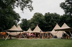 several tents set up in the middle of a field