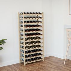 a wooden wine rack filled with lots of bottles