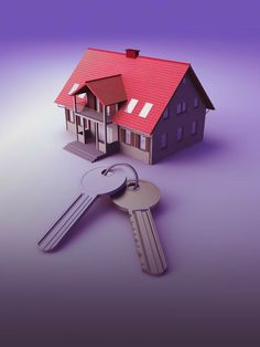 a house with keys in front of it on a purple background that looks like the real estate