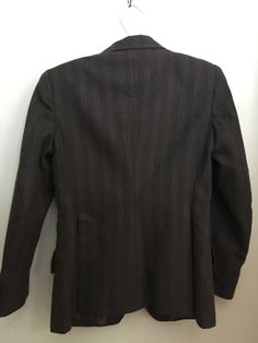 "Beautifully made equestrian jacket made by the Equestrian company ( in Romania). Jacket is fully lined in a lightweight nylon with 3 buttons down the front and three functional pockets; this jacket was made to present in horse shows. Made from a wool blend and in very good condition, has very slight wear. Shoulders have slight padding for shape. Labeled a youth size 12 Shoulders 14\" Chest 32\" Waist 29\" Hips 40\" Length from top of shoulder to hem 22.5\" Arm length from top of shoulder to cuf Tailored Striped Outerwear For Fall, Fitted Striped Sport Coat For Business Casual, Striped Formal Outerwear With Buttons, Formal Striped Outerwear With Buttons, Striped Business Outerwear With Pockets, Business Striped Outerwear With Pockets, Striped Business Casual Outerwear With Pockets, Pinstripe Outerwear With Welt Pockets For Fall, Classic Pinstripe Blazer For Winter