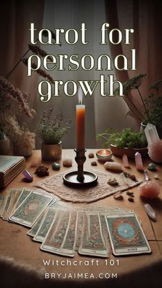 the tarot for personal growth book cover is shown on a table with cards and candles