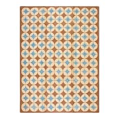 a brown and blue rug with circles on it