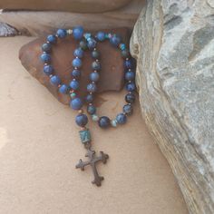 This Anglican Rosary is made with Dumortierite, which is noted for it's deep earthy blue color. It is paired with copper and Turquoise resulting in a beautifully balanced, organic set of prayer beads. The cross is a antique Spanish style in a rustic brown color. Earthy Blue, Anglican Prayer Beads, Anglican Rosary, Copper And Turquoise, Christian Prayers, Rustic Brown, Spanish Style, Prayer Beads, Rosary