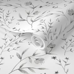 a white wallpaper with flowers and leaves on it's side, in grey tones