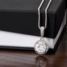 A beautiuful gift for a loved one. Eternal hope necklace.     Surprise your loved one with a timeless and elegant gift. Our dazzling Eternal Hope Necklace features a center cushion cut cubic zirconia that will sparkle with every step. The center crystal is adorned with equally brilliant CZ crystals, ensuring a stunning look every wear. Wow her by gifting her an accessory that will pair with everything in her wardrobe!     14k white gold finish over stainless steel 8mm center cushion-cut cubic zi Crystals Pendant, Wife Necklace, Hope Necklace, Crown Necklace, 2023 Christmas, Shop Gift, Mors Dag, White Gold Necklaces, Mom Necklace