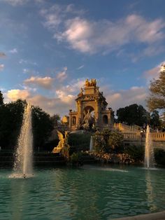 a large fountain in the middle of a park