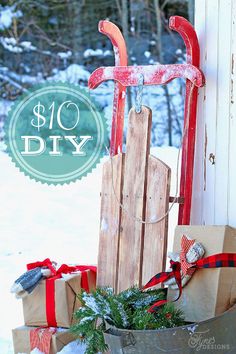 an old sled with christmas presents in it and the words, $ 10 diy