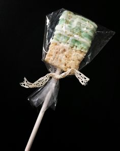 a lollipop is wrapped in plastic on a stick