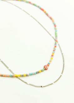 We did the work for you. This double layered necklace features a colorful, mini beaded strand with a simple chain. A layered look that adds a pop of color and texture without overdoing it. Lobster clasp Beaded Chain Length: 14.5 inches Brass Chain Length: 15.38 inches Extender: 2.5 inches Brass chain, beads, surgical stainless steel adjustment links Imported, Korea Multicolor Double Strand Jewelry With Tiny Beads, Adjustable Multicolor Beaded Necklace With Chain, Double Strand Beaded Necklaces For Layering, Double Strand Beaded Necklace For Layering, Double Strand Colorful Beaded Necklaces For Layering, Multicolor Double Strand Beaded Chain Necklace, Multicolor Beaded Chain For Jewelry Making, Multicolor Beaded Chain Layered Necklace As Gift, Multicolor Beaded Chain Necklace With Round Beads