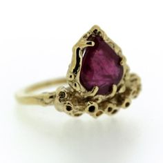 One of a Kind Hand-carved + One of a Kind. Details reminiscent of coral or sea sponge are carefully and individually sculpted to cluster around a beautiful ruby. This unique stone is semi-translucent with a stunning interior structure. Just over 2 Carat rustic Ruby + Recycled 14K Yellow Gold.*Leave us a note at checkout with size needed. This ring will be sized to fit upon order. See something you're in love with, but want more choices? Different stones, sizes, or specifics? We are also happy to Unique Ruby Rings, Sea Sponge, Stunning Interiors, Recycled Silver, Recycled Gold, Yellow Gold Ring, Ruby Ring, 2 Carat, Yellow Gold Rings