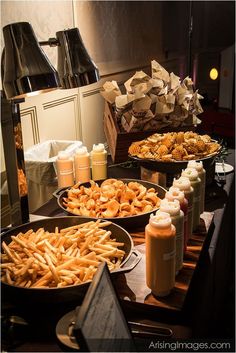 there are many different types of food on the table together, including french fries and macaroni and cheese