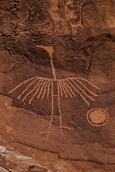 a bird painted on the side of a rock