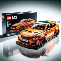 an orange car is shown in front of a box