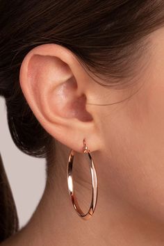 Handcrafted in Milan, Italy of 18K rose gold, this hoop earring's soft rich hue is created by an 18K rose gold alloy base plated with layers of lush 18K rose gold. Classic in look with a contemporary elongated design, this wardrobe builder is lightweight, features a pin and butterfly closure and is perfectly balanced for everyday wear. Each piece is handmade by Italian artisans, in small quantities, so you know that your jewelry is unique. 18K Rose Gold 1 3/4" Length 1/8" Width Patented Golden R Modern Small Hoop Rose Gold Earrings, Elegant Small Hoop Earrings In Rose Gold, Elegant Small Hoop Rose Gold Earrings, Rose Gold Small Hoop Jewelry, Modern Rose Gold Small Hoop Earrings, Modern Rose Gold Tarnish Resistant Hoop Earrings, Modern Rose Gold Tarnish-resistant Hoop Earrings, Modern Tarnish-resistant Rose Gold Hoop Earrings, Elegant Pink Gold Hoop Earrings