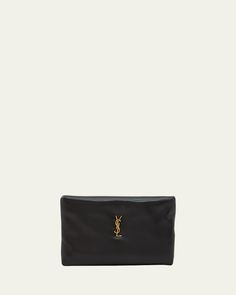 Saint Laurent "Calypso" pouch clutch bag in padded leather     Features signature YSL logo lettering     Zip top closure     Exterior, one card slot     Bronze hardware     Approx. 5.9"H x 11.8"W x 1.3"D    Made in Italy Leather Rectangular Cosmetic Bag For Evening, Luxury Evening Clutch With Zipper Pouch, Evening Leather Cosmetic Bag With Removable Pouch, Leather Evening Cosmetic Bag With Removable Pouch, Designer Soft Leather Pouch Clutch, Leather Cosmetic Bag With Removable Pouch For Evening, Evening Leather-lined Pouch, Leather Evening Cosmetic Pouch, Leather Pouch Cosmetic Bag For Evening