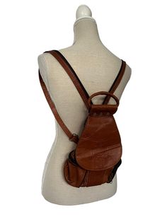 Vintage Womens 1970s Leather Brown Indian Bagpack Rucksack Embossed Tooled Ethnic Hippy Handprint, Zip pockets at the side with little compartments A lovely shaped bag Beautifully made, Lovely handle to wear as a mini bag also Measurements Length 14 Inch Width 9 Inch Vintage Leather Backpack With Adjustable Strap For School, Vintage Leather Shoulder Backpack For School, Retro Leather Backpack, Vintage Leather Backpack With Adjustable Strap For Everyday, Vintage Leather Backpack For Daily Use, Vintage Brown Leather Backpack For Everyday, Retro Brown Leather Backpack For Daily Use, Vintage Leather Backpack For School, Vintage Brown Leather School Backpack