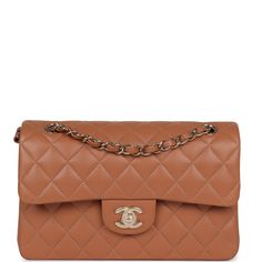 This Chanel Small Classic Double Flap is in Caramel Lambskin with Gold hardware, front flap with CC turnlock closure, half moon back pocket and adjustable interwoven gold chain link and lambskin leather shoulder/crossbody strap. The interior is lined in Caramel leather and features a small zip pocket with Chanel pull and slip pocket underneath on the rear wall.Collection: 2022 (RFID chip)Origin: FranceCondition: New and never worn (plastic on hardware) Accompanied by: Chanel Box, Chanel dustbag, Chanel Mini Rectangular, Chanel Classic Flap Bag, Chanel Box, Classic Flap Bag, Chanel Mini, Gold Chanel, Lk Bennett, Rene Caovilla, Pierre Hardy