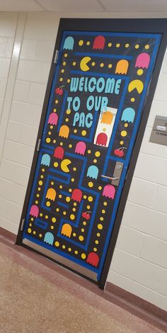 a door decorated with an image of pacman and the words welcome to our pac