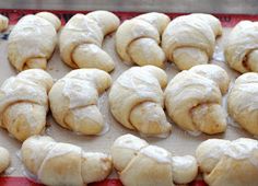 freshly baked pastries on a baking sheet ready to be cooked in the oven for consumption