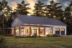 this is an artist's rendering of the modern farmhouse style home in the woods