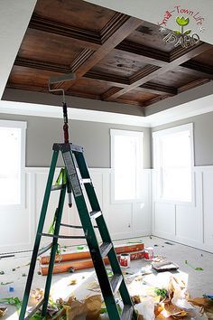 a ladder is in the middle of an unfinished room