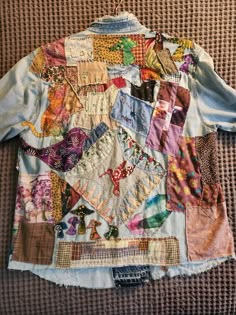 a shirt that has many different patches on it