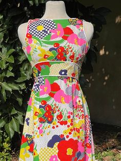 "Amazing Vintage Patty Woodard Bright Multicolored Floral Print Sleeveless Dress - Size S  Back zip closure  High waist  White trim No marked size. Please go by measurements. Measurements (laid flat, not doubled): Shoulder to shoulder: 11.5\" Underarm to underarm: 15.5\" Waist: 13\" Full length: 52\" Condition: great ! Feel free to message me with any questions before purchasing :)" Sleeveless Multicolor Print Dress For Garden Party, White Retro Sleeveless Spring Dress, Sleeveless Multicolor Dress For Garden Party, Multicolor Sleeveless Dress For Garden Party, Multicolor A-line Sleeveless Dress With Floral Print, Multicolor Print Sleeveless Dress For Spring, White Sleeveless Dress With Colorful Pattern, Multicolor Sleeveless Midi Dress With Floral Print, Multicolor Sleeveless Lined Dresses