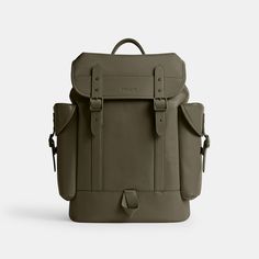 a small backpack with straps on the front and side pockets, in grey leathers