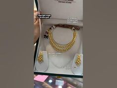 the necklace and bracelets are displayed in a box with instructions on how to wear them