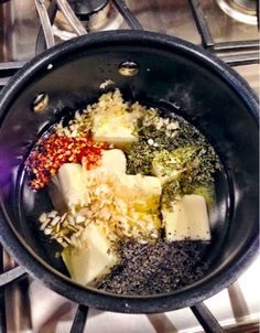 a pan filled with food on top of a stove