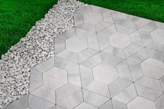 Smooth, clean pavers create a contemporary look. Perfect for patios, walkways, and outdoor rooms. Mix and match with Hexagon paver to create geometric patterns. Subtle light gray color tone. Color, dimension, weight and texture may vary slightly due to natural materials used during manufacturing. Oldcastle 12-in L x 5-in W x 2-in H Trapezoid Rio Blend Concrete Patio Stone in Gray | 10996061 Backyard Slabs Concrete Patios, Hexagon Pavers Patio, Patio Paver Patterns, Rowhouse Backyard, Hexagon Pavers, Backyard Paver Ideas, Hexagon Patio, Large Concrete Pavers, Backyard Hardscape