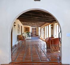 an arched doorway leading to a living room