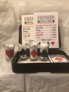 there is a tray with drinks on it and a sign that says drunk spades